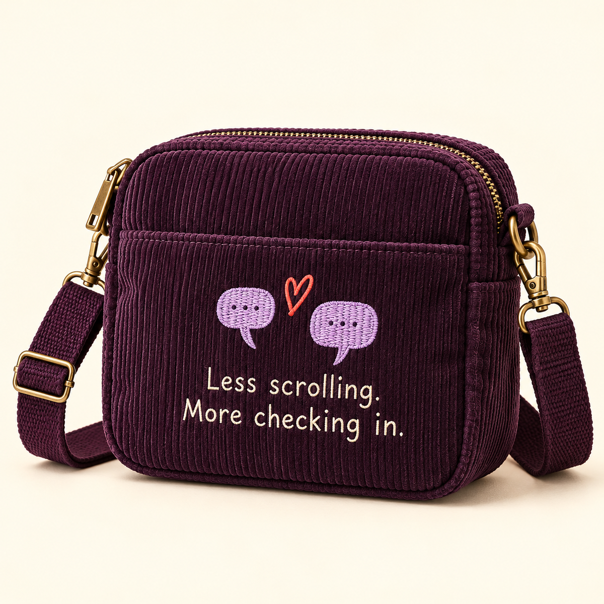 Plum crossbody bag with lavender speech bubbles, a coral heart, and Less scrolling. More checking in. message