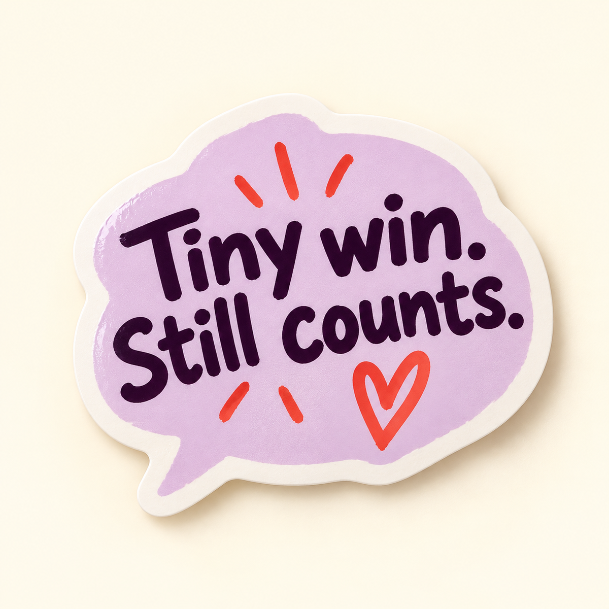Lavender speech-bubble sticker with plum Tiny win. Still counts. lettering and coral heart and accents